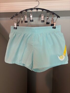 Light Blue Nike Women’s Active Shorts with Yellow Accent